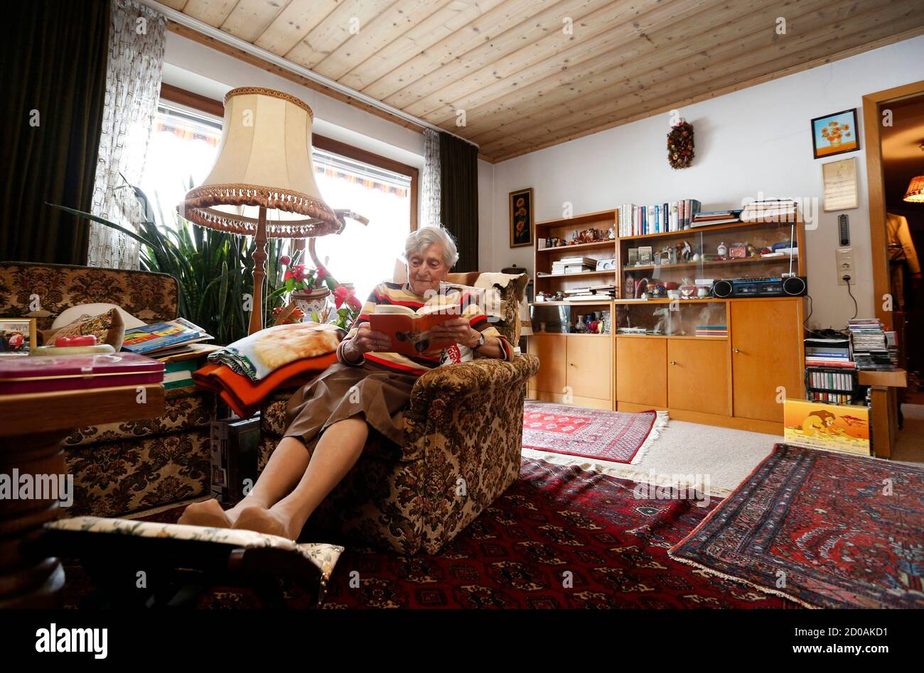 German waitress Kathi Kink, aged 91, takes a break in her home close to the  'Zum Goldenen Tal' restaurant in Naring near Weyarn, southern Germany,  February 2, 2015. Since 1939 at the