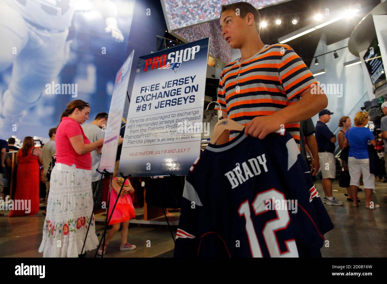 Fans pick out replacement jerseys in exchange for jerseys of former New  England Patriots player Aaron Hernandez at the club's merchandise shop in  Foxborough, Massachusetts July 6, 2013. The Patriots offered the