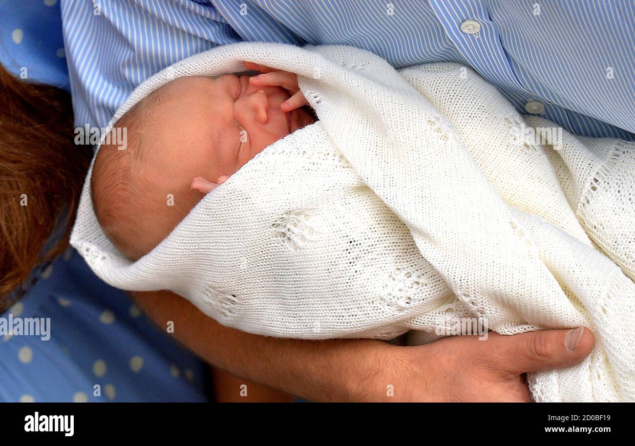 Britain S Prince William Holds His Baby Son Outside The Lindo Wing Of St Mary S Hospital Before Leaving With Catherine Duchess Of Cambridge In Central London July 23 13 Kate Gave Birth To