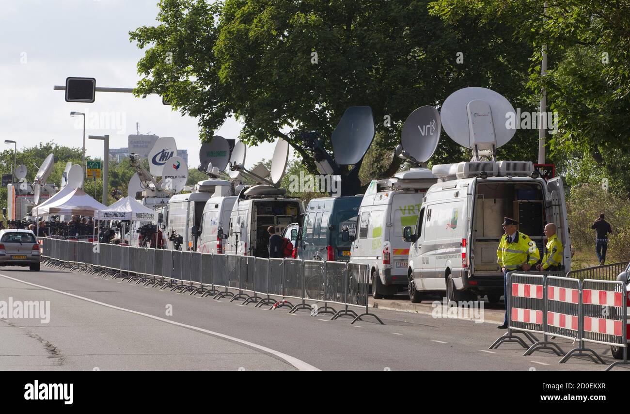 Satellite vans used for live news reports are lined up in front of the  Scheveningen prison as media personnel wait for the arrival of former  Serbian military commander Ratko Mladic in The