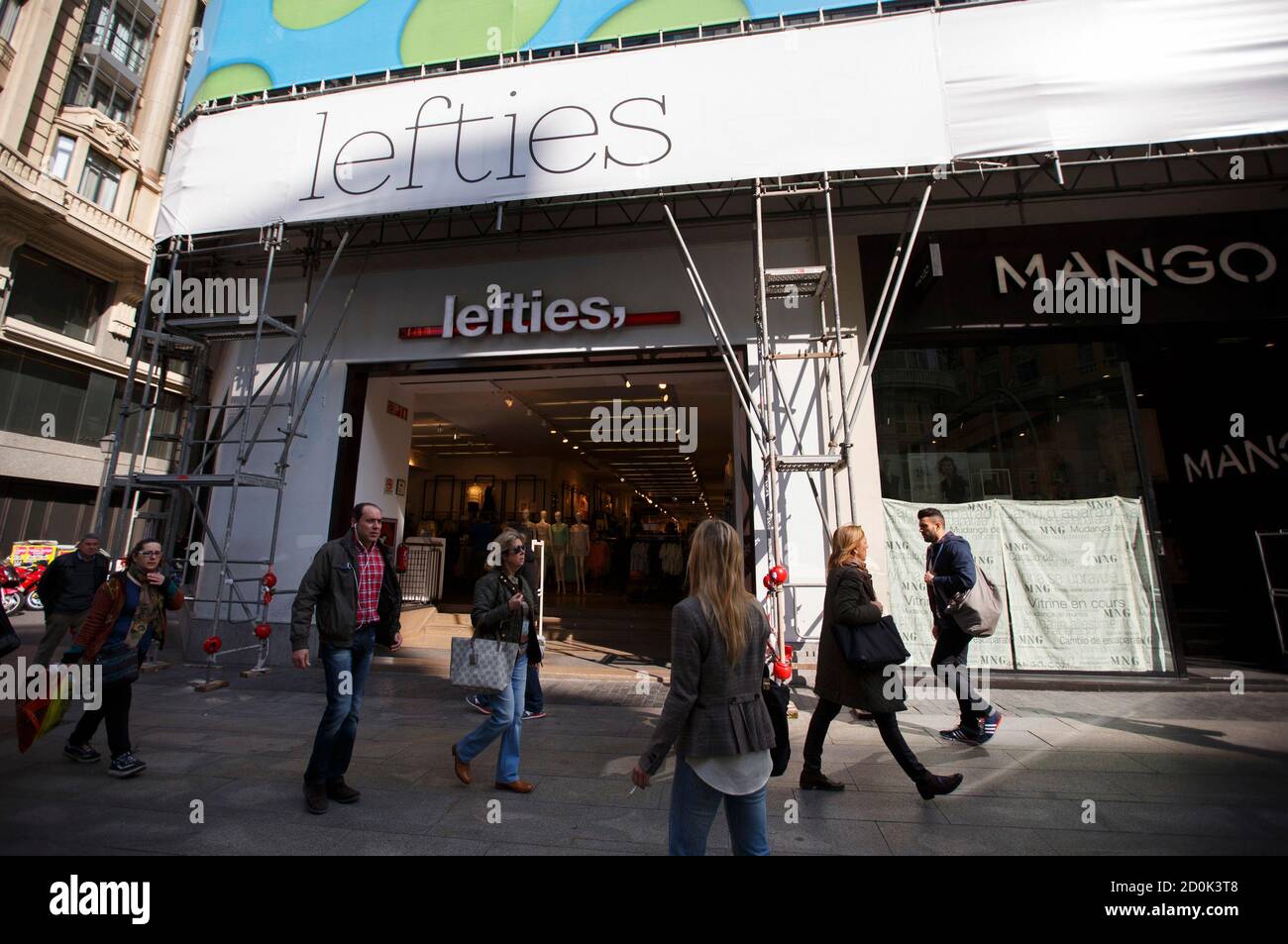 People walk past a Lefties store in central Madrid March 12, 2014. While  Inditex's Zara and other brands have seen tepid sales growth in Spain in  recent years, the company has quietly
