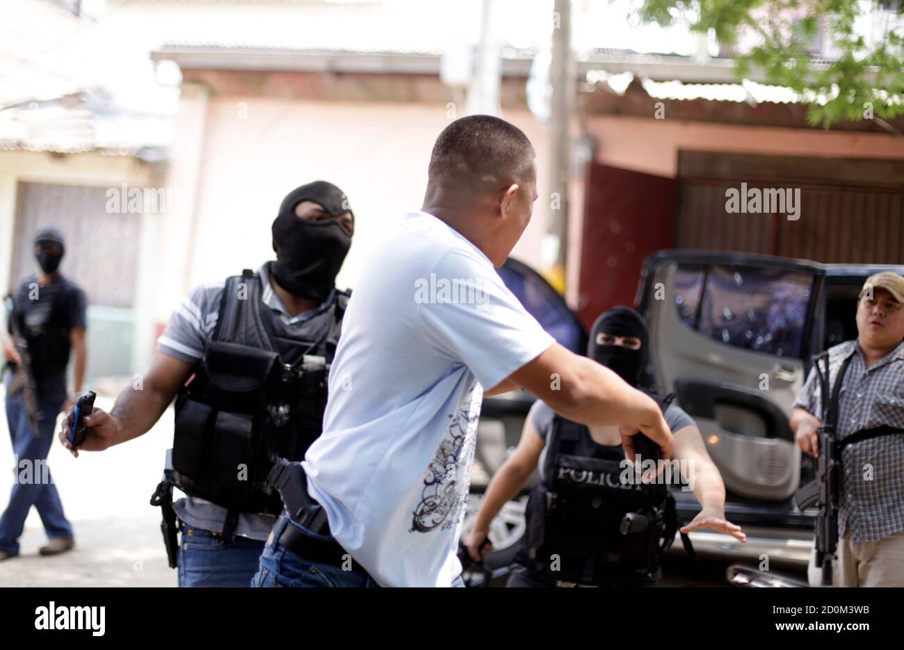 A Body Guard R Who Escaped An Armed Attack Unharmed Reacts At The Crime Scene Where His Colleagues A 17 Year Old School Girl And Four Other People Were Shot Dead In Tegucigalpa
