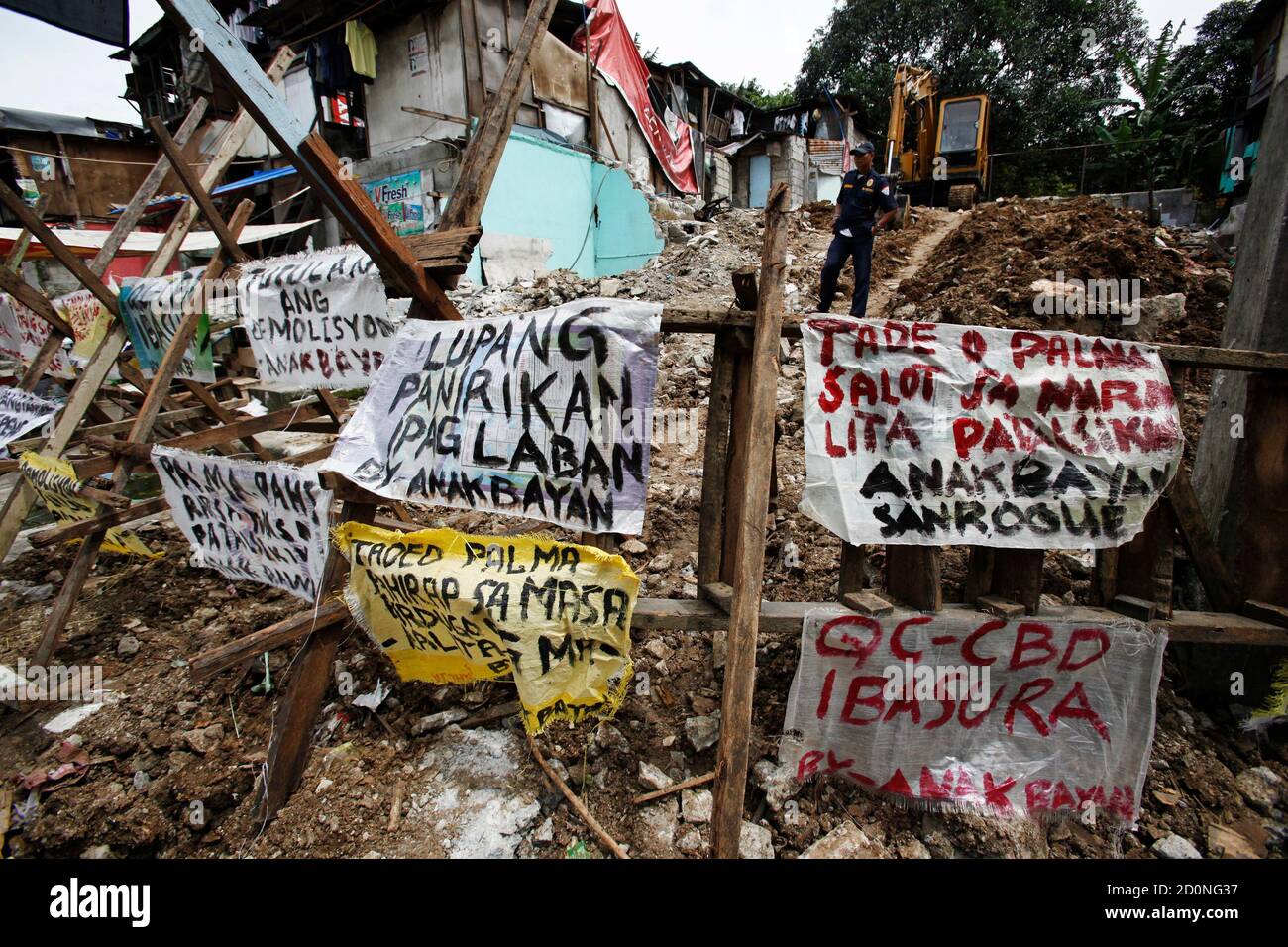 A Security Guard Watches Over A Partly Demolished Squatter Settlement In Quezon City On The Suburbs Of Metro Manila September 23 11 Authorities Have Attempted To Forcefully Evict Squatter Dwellers From The