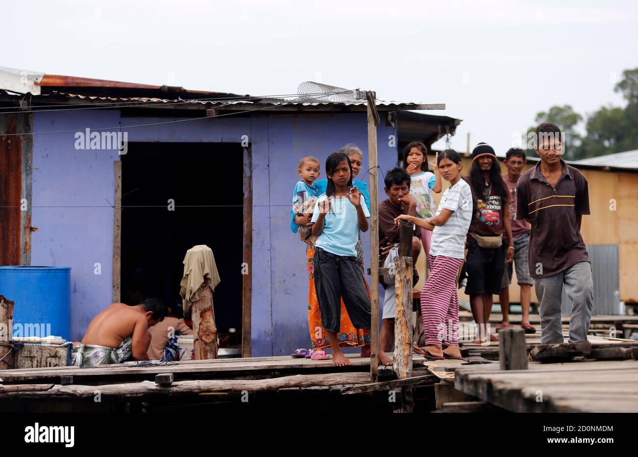 Residents Of Pulau Gaya S Water Village Who Are Mostly Filipino Migrants Gather Outside Their Houses On The Sea Outside Kota Kinabalu September 17 12 With A General Election Due Within Seven Months