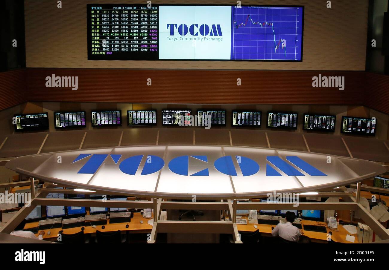 Employees Of Tokyo Commodity Exchange Tocom Look At Monitors As Other Monitors On The Wall Show The Prices Of Crude Oil Top Left And A Graph Of The Recent Fluctuations Of Crude