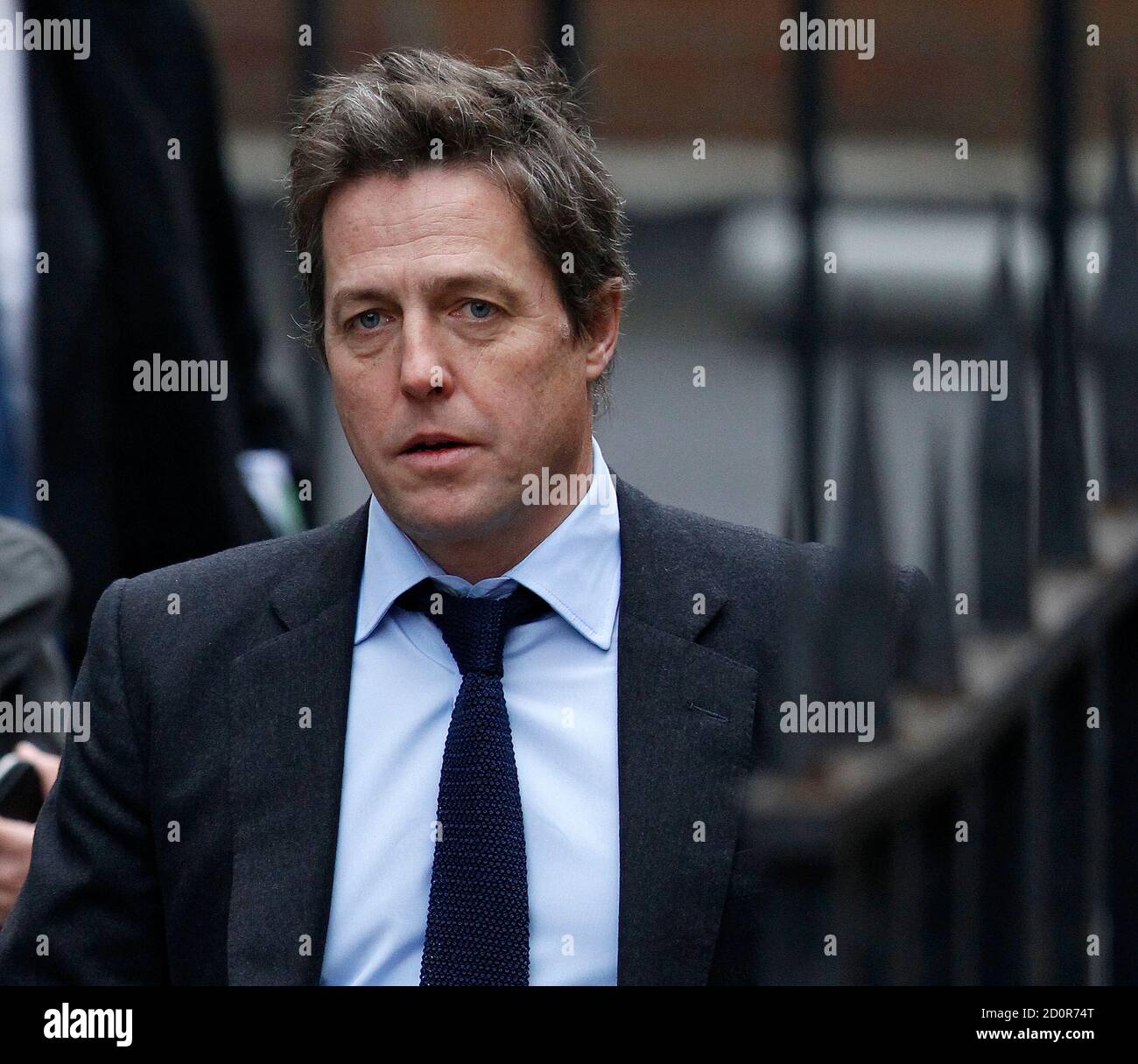 British actor Hugh Grant arrives at the Leveson Inquiry at the High Court  in central London, November 21, 2011. Hollywood stars and other  high-profile figures will try to turn the tables on