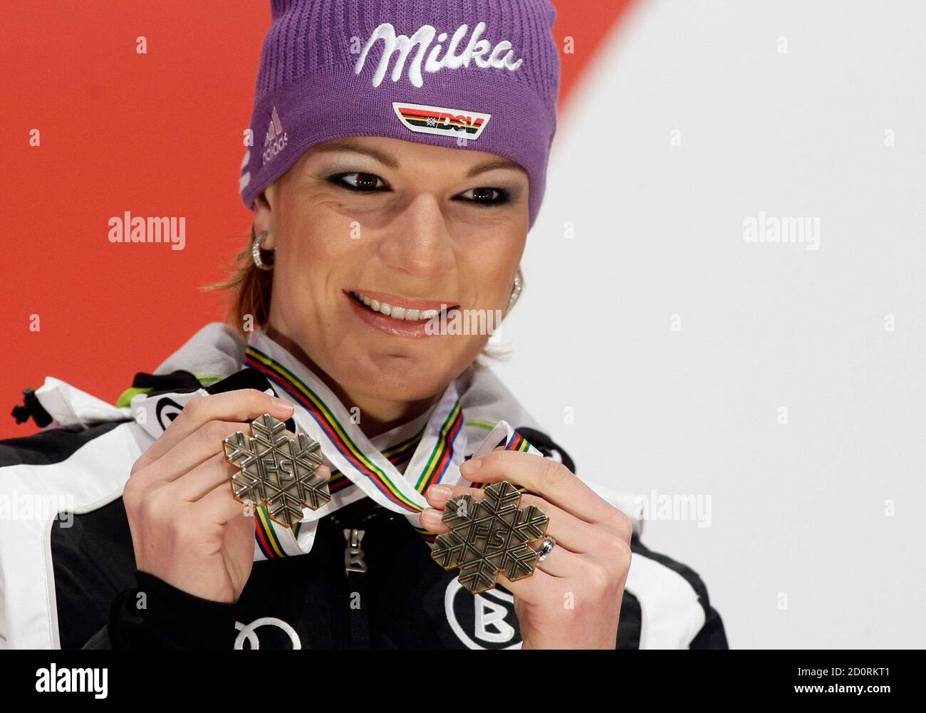Maria Riesch of Germany poses with her Super-G and Downhill bronze medals following the women's Downhill at the Alpine Skiing World Championships in Garmisch-Partenkirchen February 13, 2011.           REUTERS/Dominic Ebenbichler (GERMANY  - Tags: SPORT SKIING) Banque D'Images