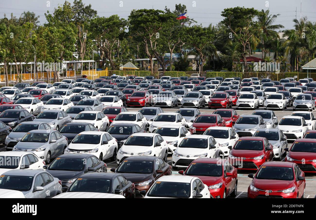 Newly assembled Toyota Vios sedans are seen at a stockyard of the Toyota  Philippines manufacturing plant in Sta Rosa, Laguna, south of Manila August  11, 2014. Top Japanese automakers in the Philippines
