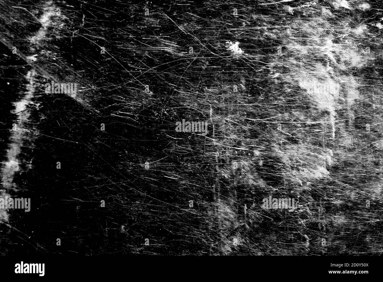 sur un fond noir, des taches blanches avec des rayures. Banque D'Images