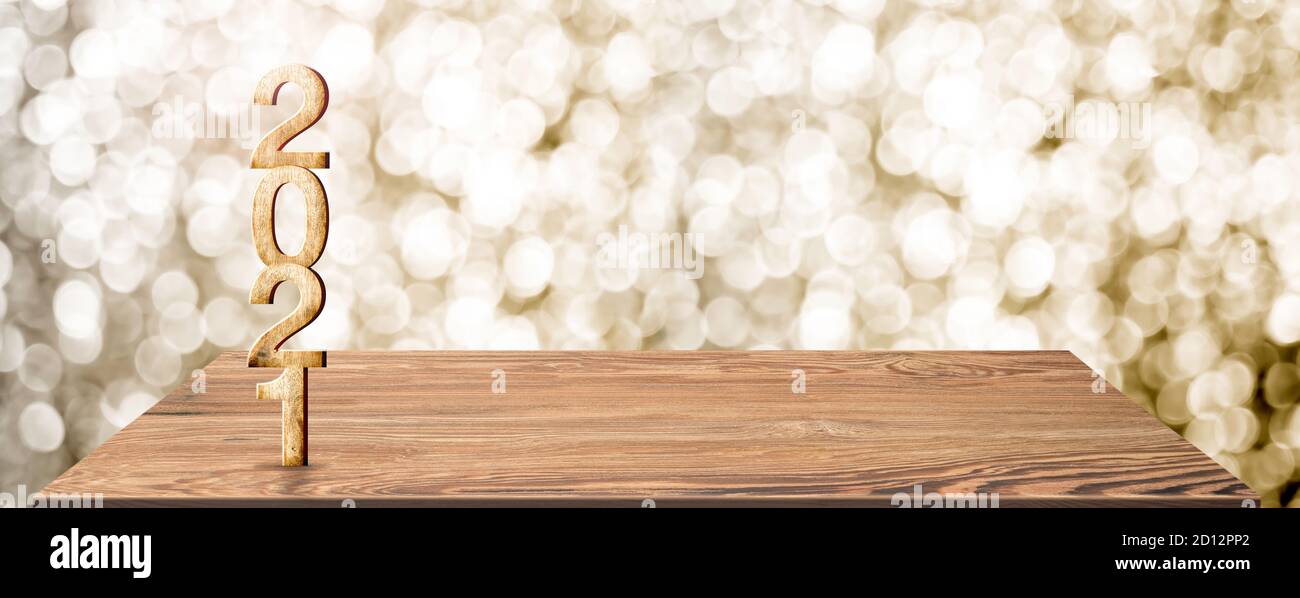 Nouvel an 2021 nombre de bois blanc (rendu 3d) Sur une table en bois au flou abstrait or bokeh arrière-plan, maquette espace de bannière pour l'affichage ou le montage de p Banque D'Images