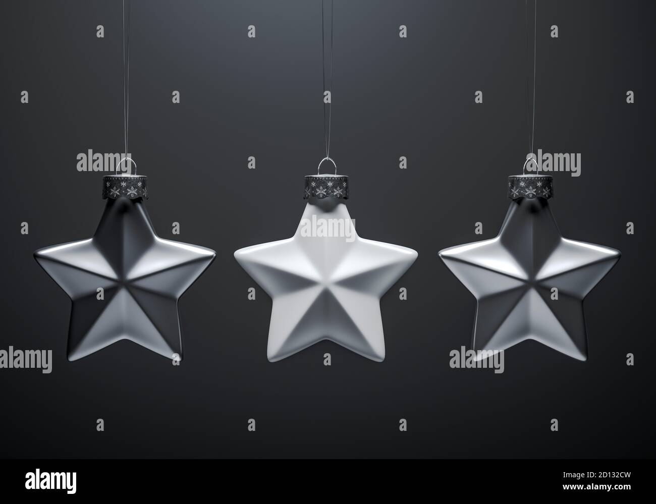 Image en noir et blanc de trois décorations de Noël en étoile à cinq points mates. Décoration de Noël, concept d'atmosphère festive. Banque D'Images