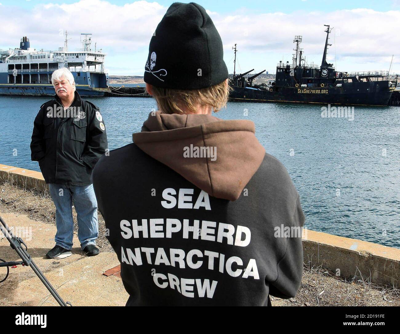 Paul Watson (L), head of the Sea Shepherd Conservation Society, stands on a  dock with a crew member of the Farley Mowat in Sydney, Nova Scotia, April  13, 2008. Canadian authorities on