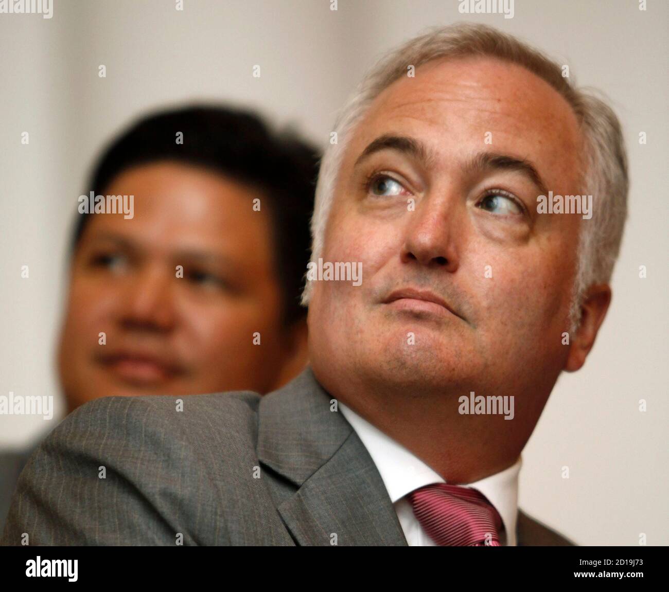 Steve Carlisle, General Motors (GM) president for Southeast Asia, watches a  presentation next to a Antonio Zara, vice president for Sales and Marketing  and Aftersales Service of Chevrolet Sales Thailand, during a