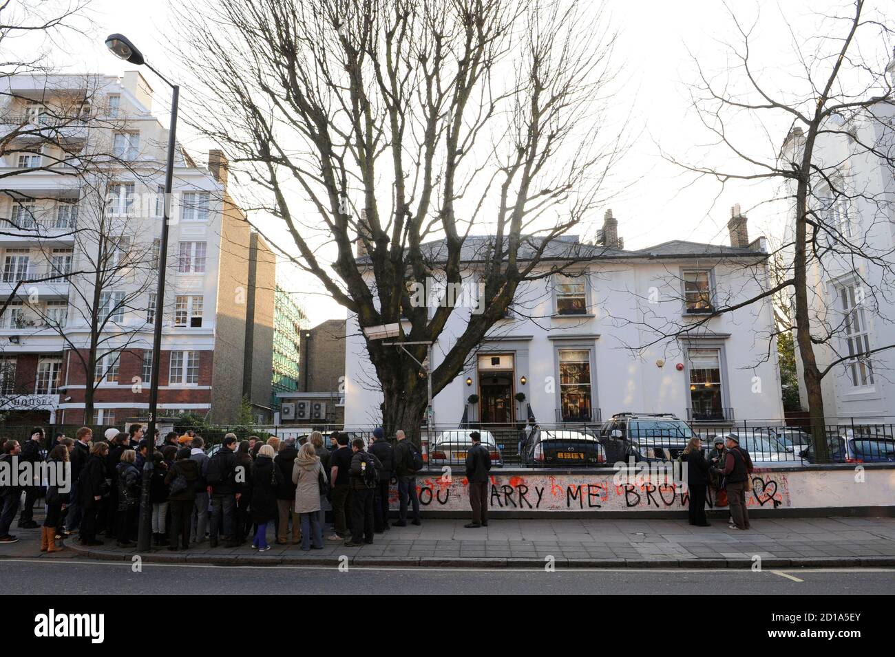 People gather outside the Abbey Road Studios, in north London February 17,  2010. The London recording studio immortalised by the multi-million-selling  Beatles album of the same name has been put up for