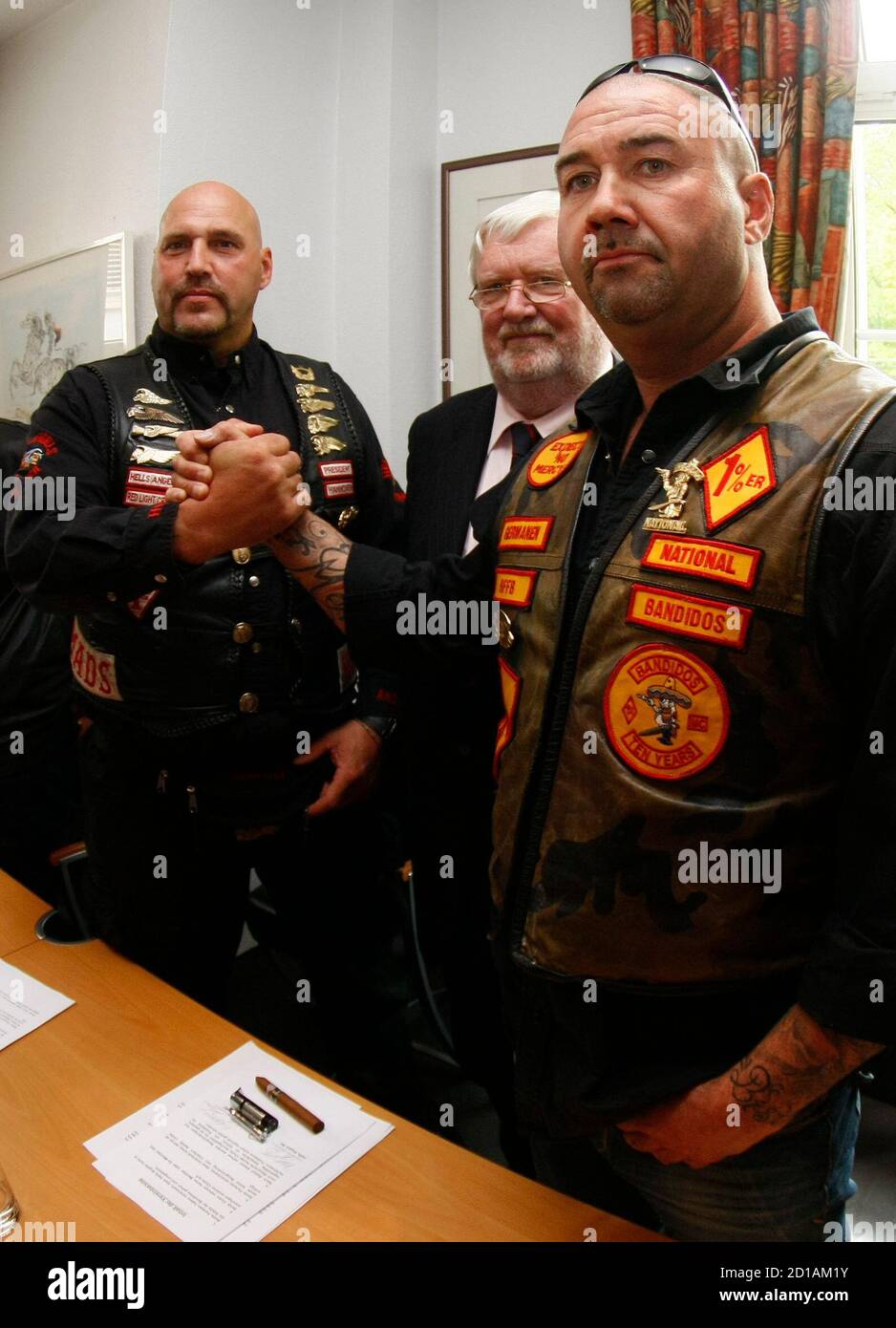 Lawyer Goetz Von Fromberg C Watches As Peter Maczollek President Of The Mc Bandidos Motorcycle Gang In Germany And Frank Hanebuth L President Of The Hells Angels Charters Of Hannover Shake Hands