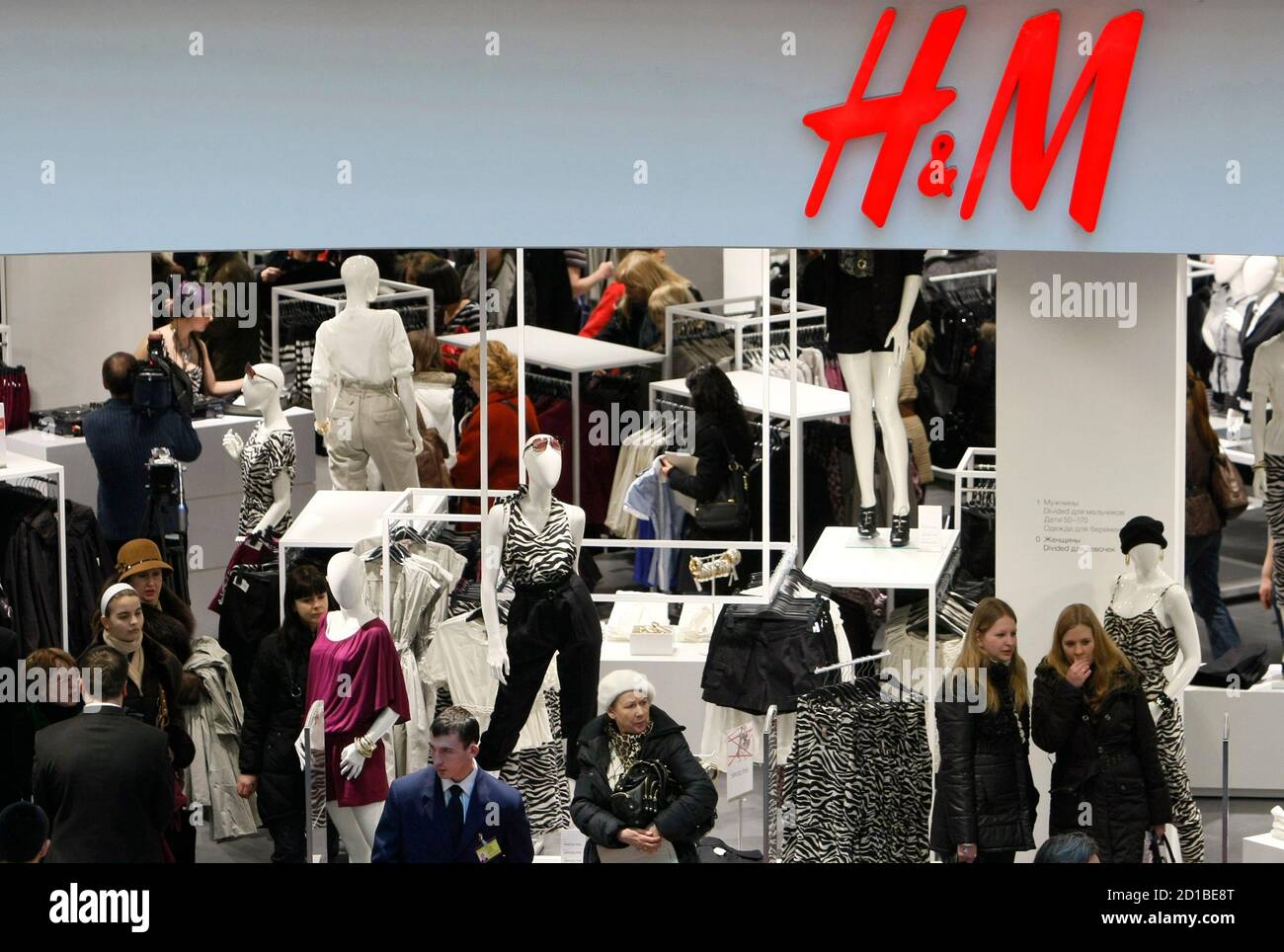 People shop in the newly opened Hennes & Mauritz (H&M) store in Moscow,  March 13, 2009. Swedish fashion giant H&M, the world's third-biggest  clothing retailer by sales after Gap Inc and Spanish
