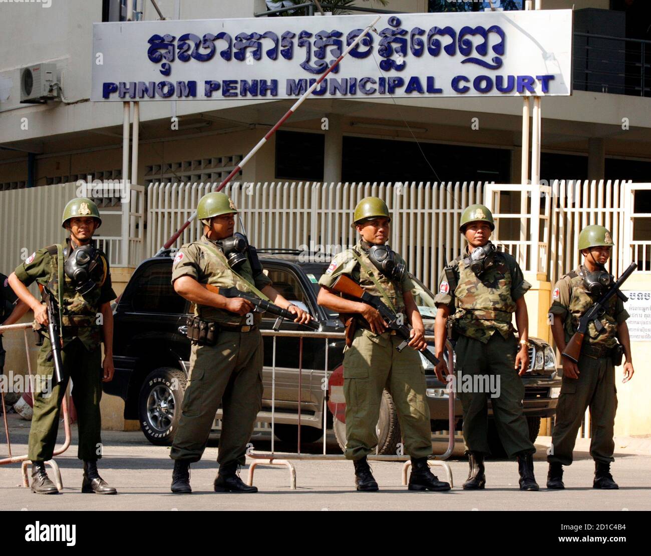 Cambodian riot police stand guard in front of a Phnom Penh municipal court,  where former Cambodia police chief Heng Pov is being charged, December 21,  2006. Heng Pov, a fugitive Cambodian former