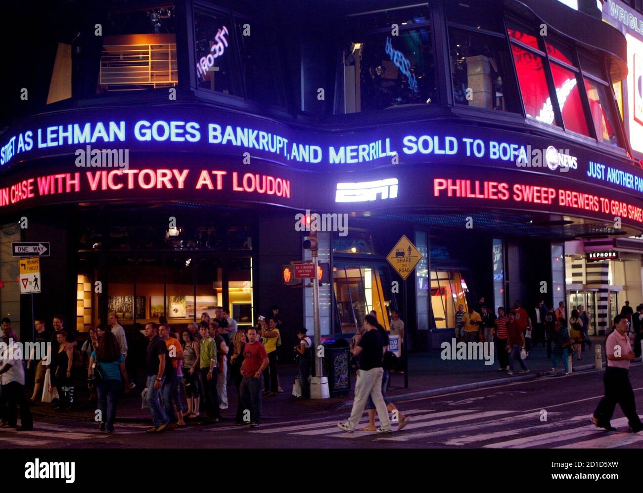 Lehman Brothers name moves across a news ticker in New York's Times Square September 15, 2008. The bankruptcy of Lehman Brothers Holdings Inc and sale of Merrill Lynch & Co Inc is