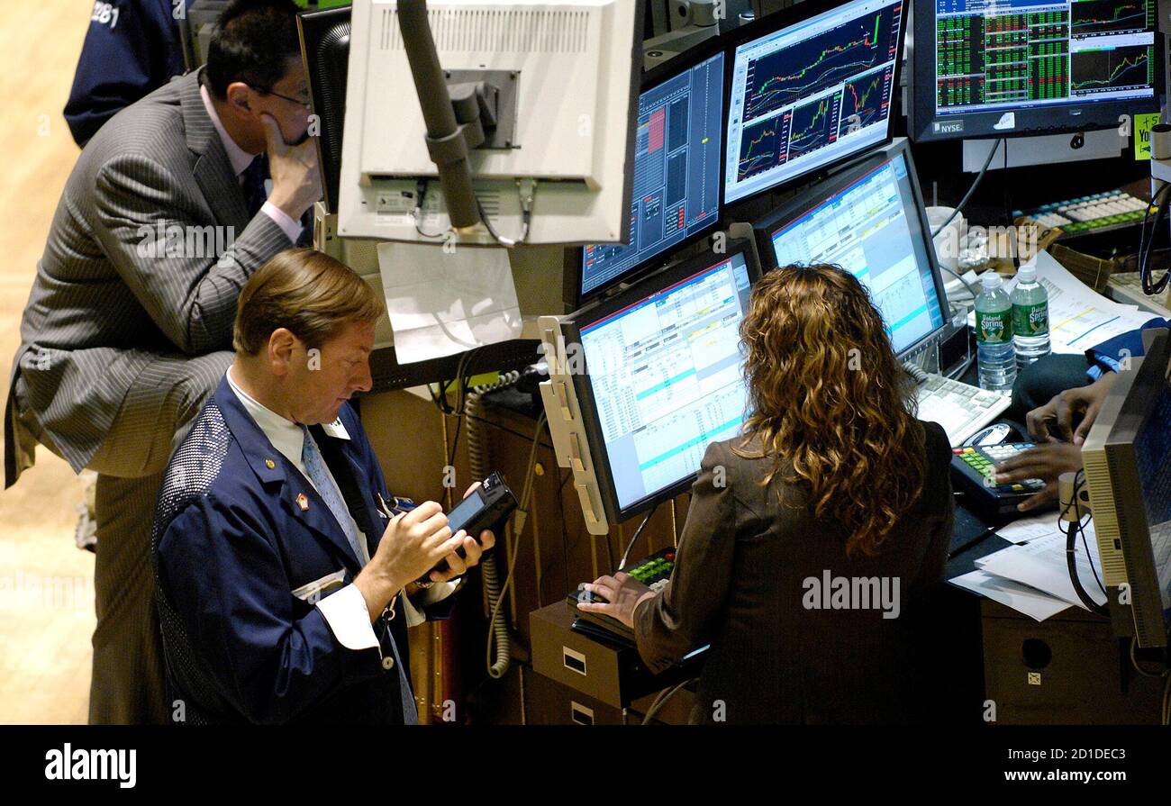 Traders work on the floor of the New York Stock Exchange ...