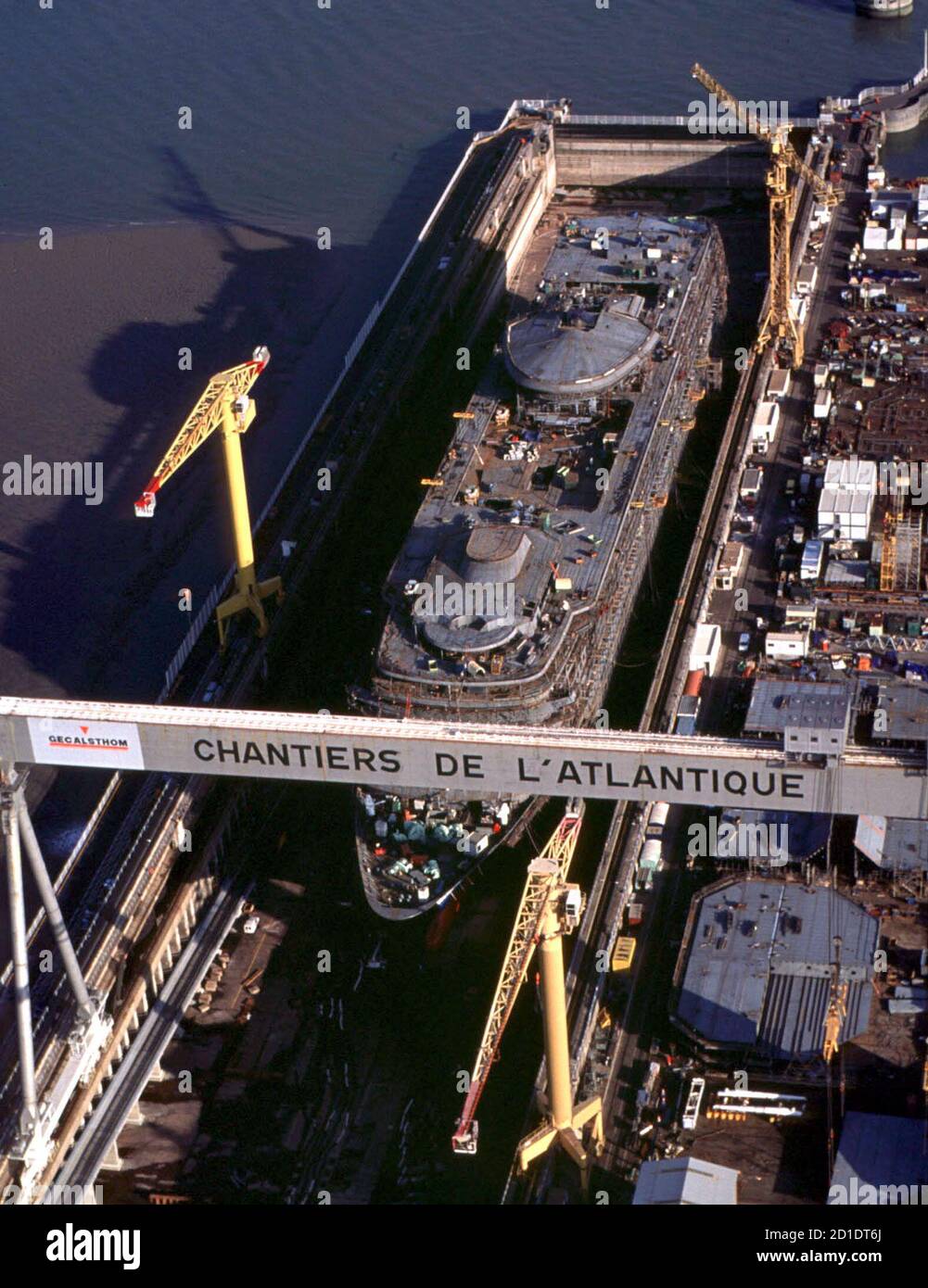 An aerial view of a ship in dry dock at the Alstom subsidiary Chantiers