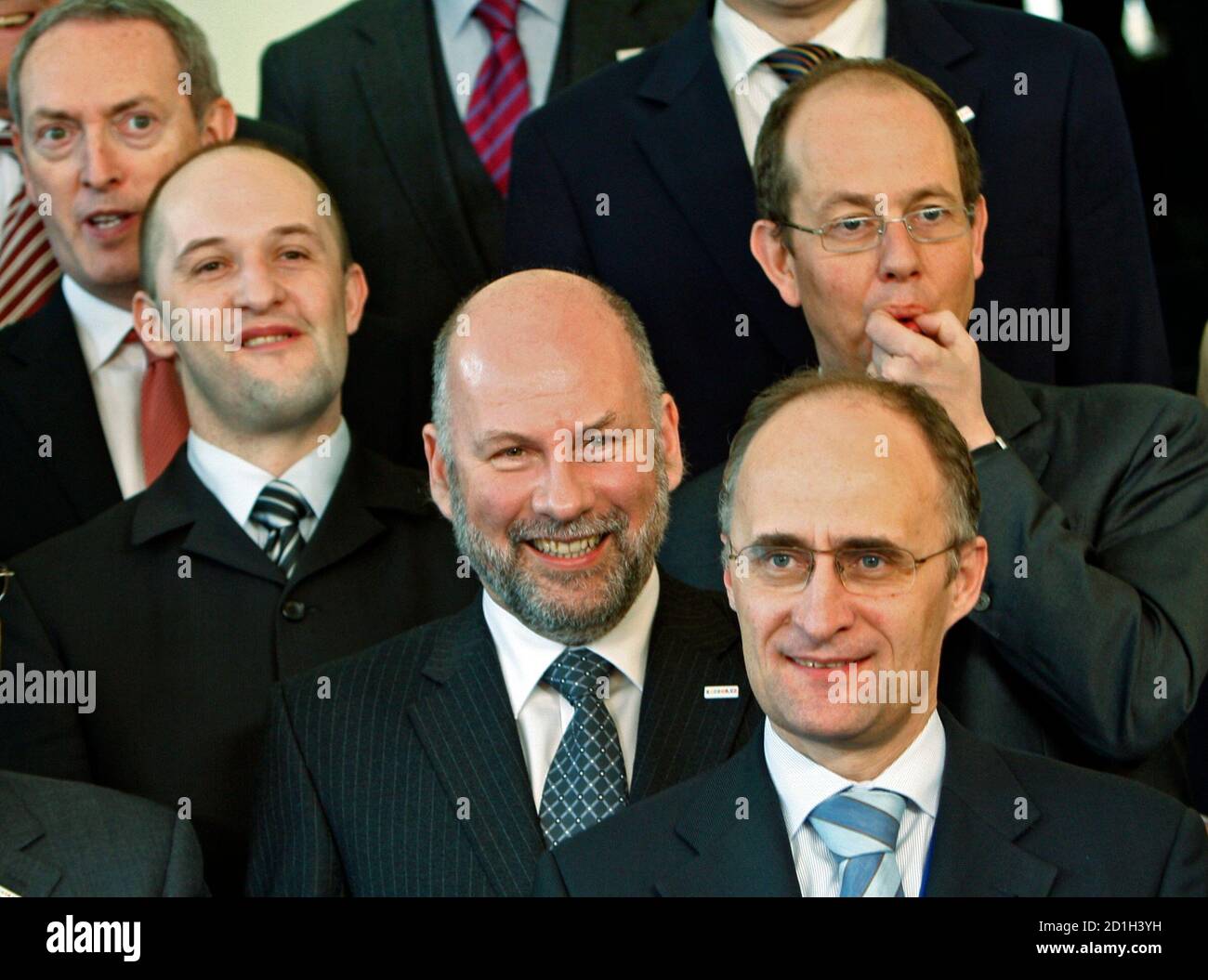Britain's Defence Minister John Hutton, Latvia's Janis Sarts, Ireland's  Michael Howard, Belgium's Geert Muylle (L-R) and Luxembourg's Aid Minister  Jean-louis Schiltz (R) react as they wait for a family photo of the