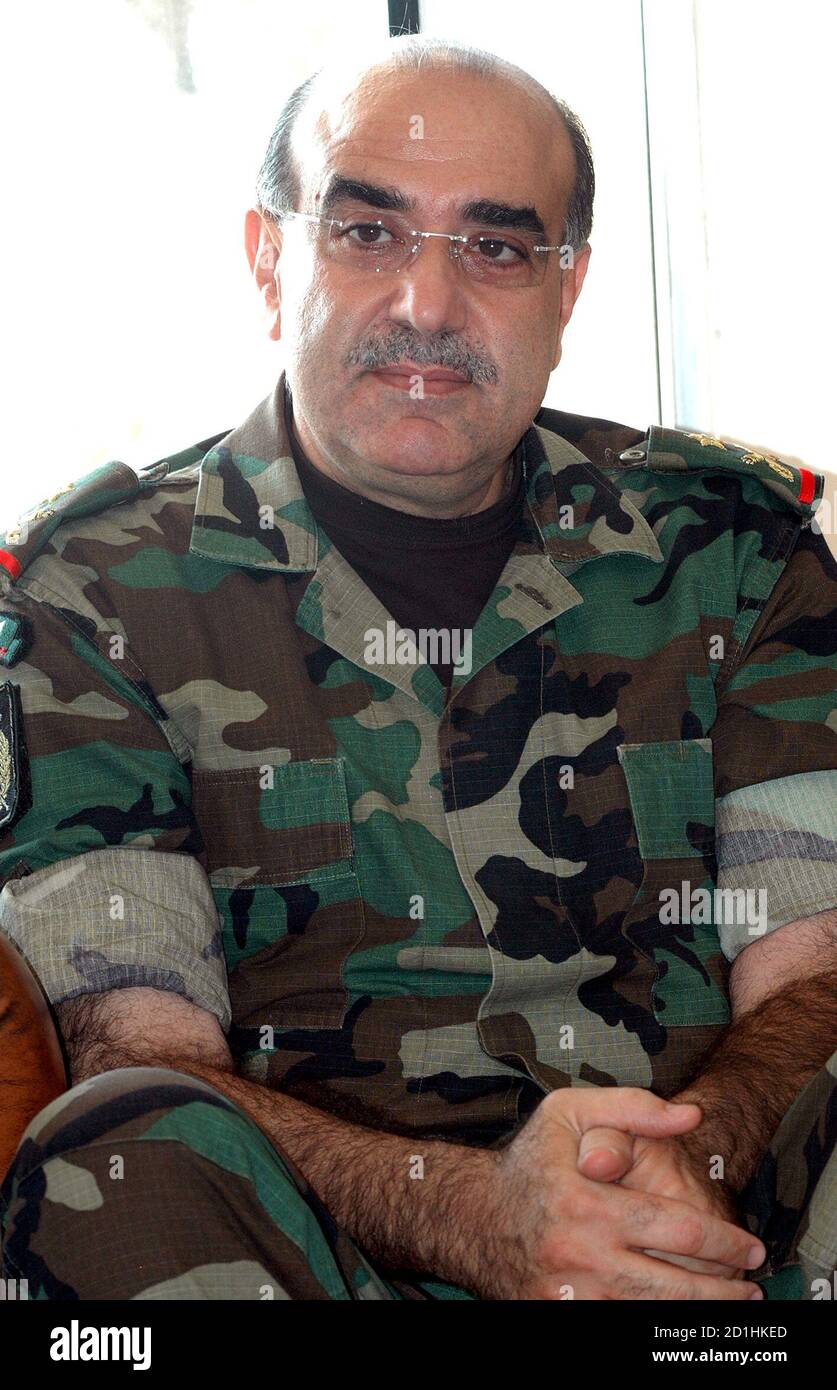 Chief of the Republican Guard Mustafa Hamdan poses in Beirut in this  undated file photo. Lebanon's prime minister said on August 30, 2005 a  senior pro-Syrian security official and three former security