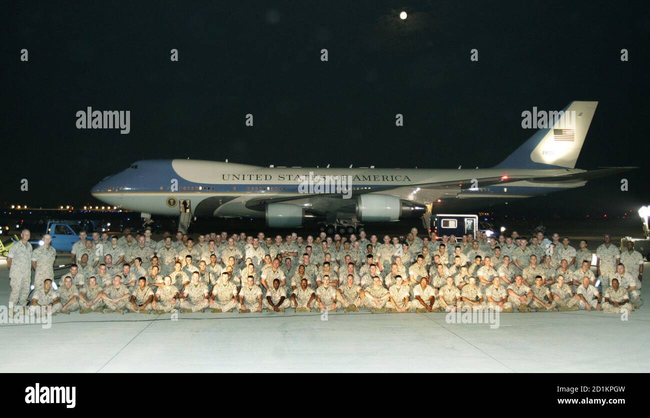U.S. Marine reservists from the 4th Civil Affairs Group based in Anacostia,  Washington, gather for a group photo in front of Air Force One on the  tarmac at Andrews Air Force Base