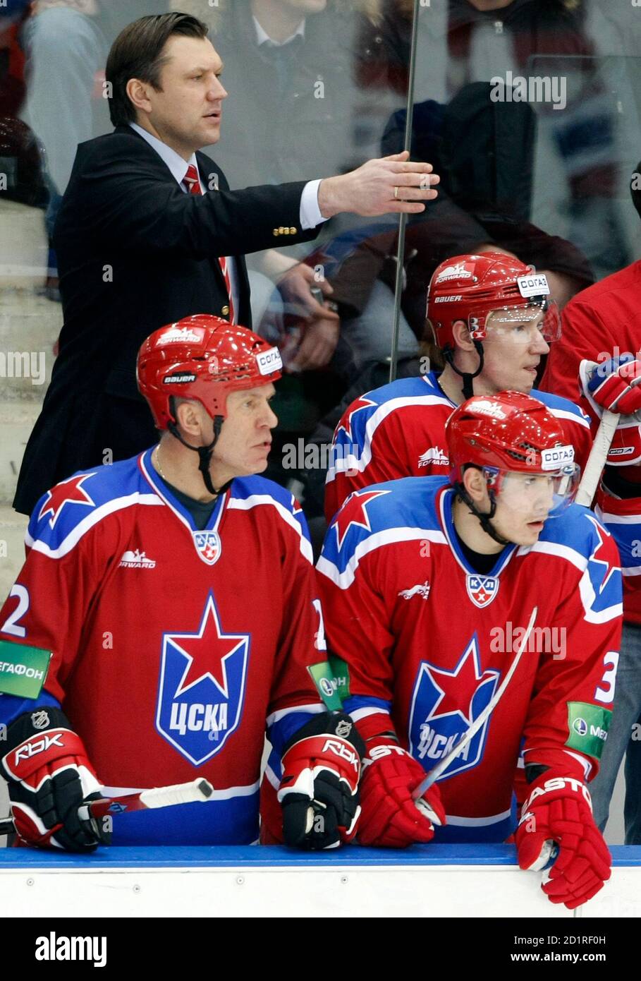 Vyacheslav Fetisov (L) of CSKA Moscow and his teammates watch during their  KHL hockey game against SKA St Petersburg in Moscow, December 11, 2009.  Fetisov, aged 51, Senator for the Primorsky Kray