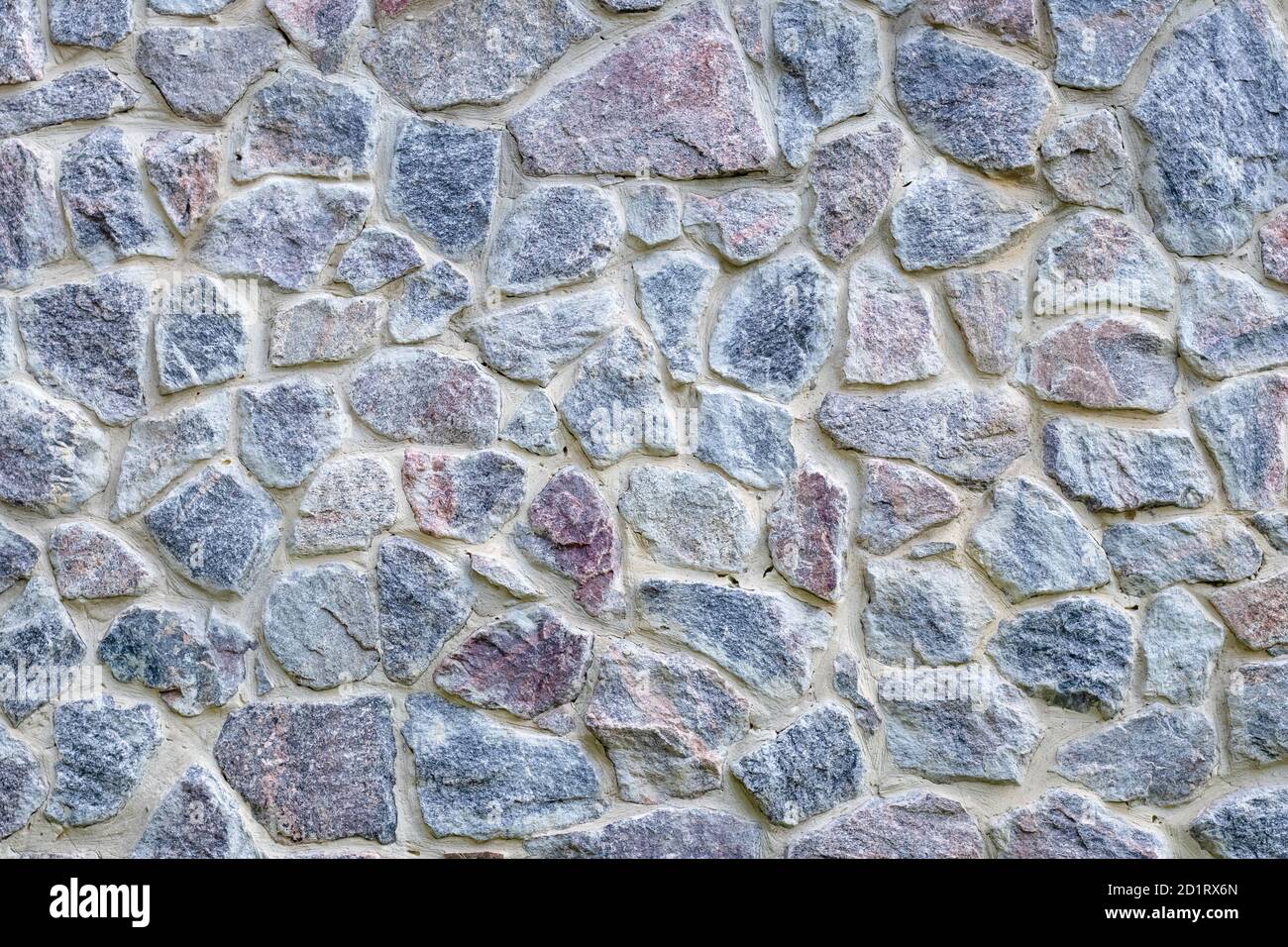 Texture de mur en pierre grise et bleue, arrière-plan de l'ancien sol. Sol naturel en pierre, motif. Surface de brique, cadre. Graftez la structure en ciment. Un élément d'arche Banque D'Images