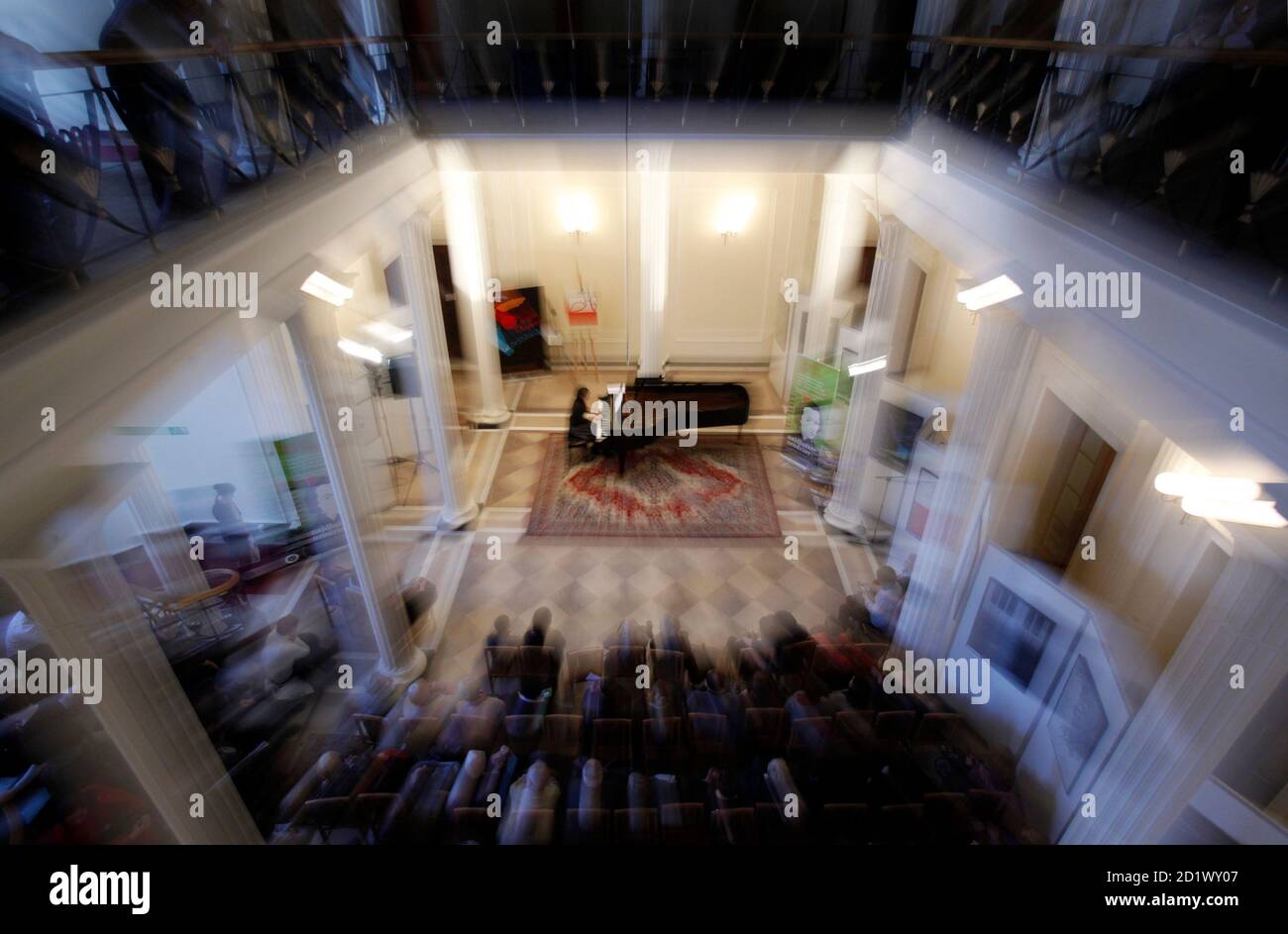 People Listen To A Pianist Perform In A Week Long Marathon Concert At Dom Poloni In Warsaw February 25 2010 With Experts Split On Whether Chopin Was Born On February 22 Or March