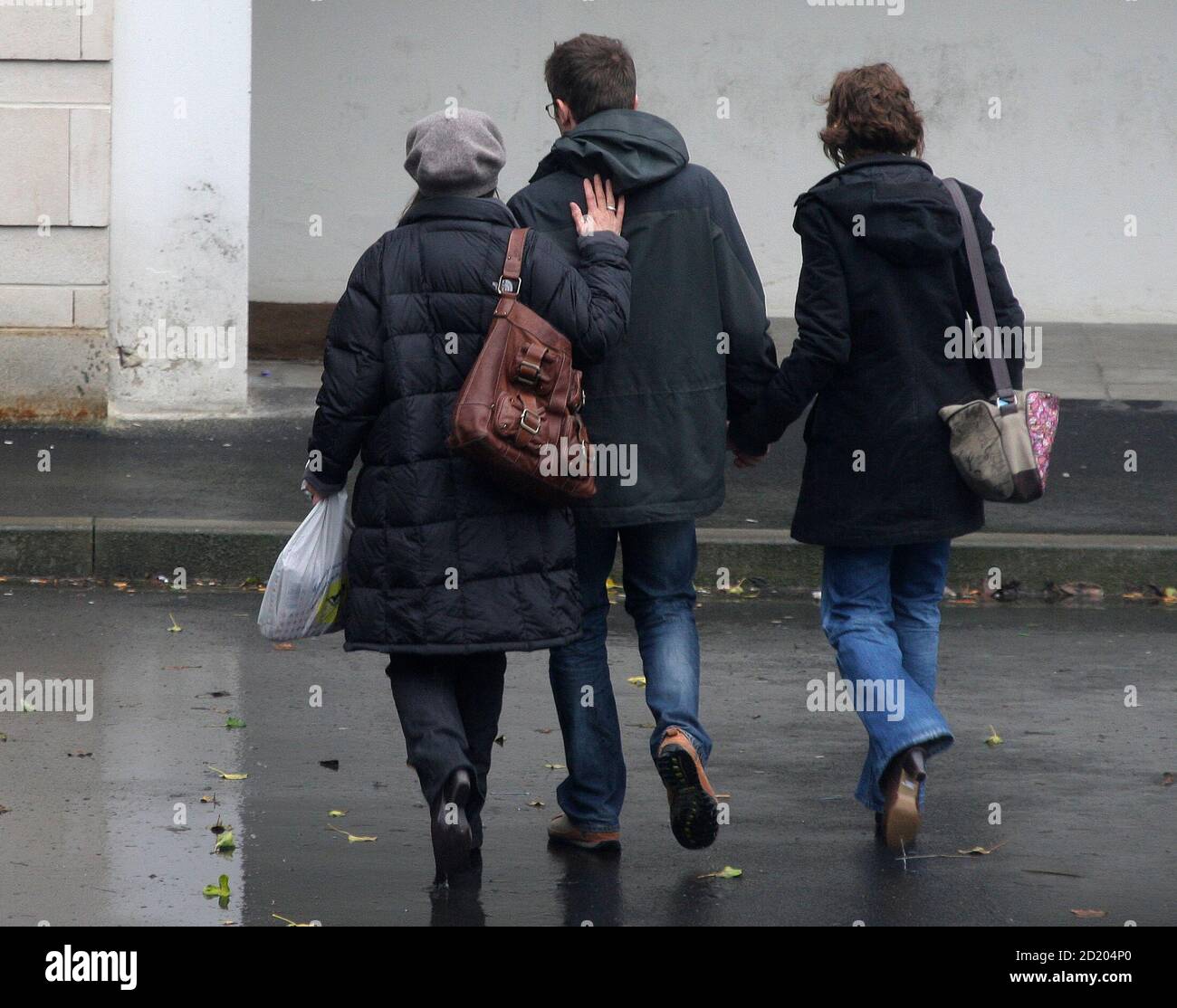 Belgian Marie-Noelle Bouzet (L), the mother of Elisabeth Brichet who was a  victim of the French self-confessed serial killer Michel Fourniret, arrives  with her son Thomas (C) and an unidentified woman at