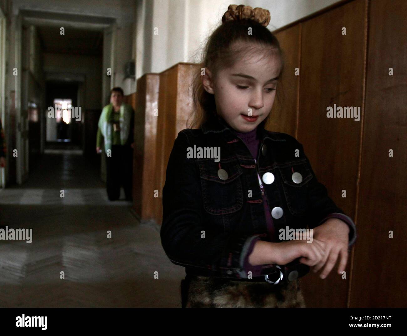 A blind girl walks in the corridor of her school during a break in Tbilisi  March 19, 2010. Forty-seven children study and live at the only boarding  school for blind children from