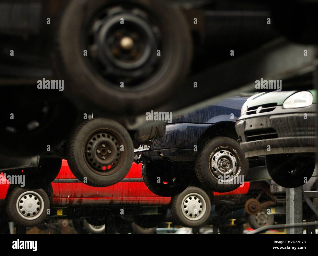 Old cars are pictured on a junkyard in the western city of Herten March 26,  2009. Germany's main coalition parties have agreed in principle to extend  incentives the government has been offering