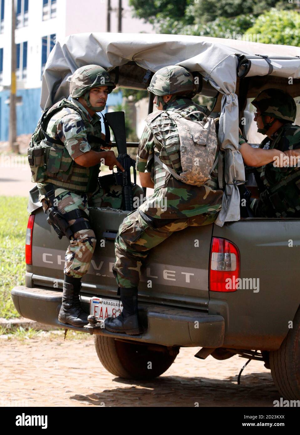 Paraguayan soldiers travel to another checkpoint during military control at  Pedro Juan Caballero, which lies near the Brazilian border of Ponta Pora,  May 2, 2010. Presidents Luiz Inacio Lula da Silva of