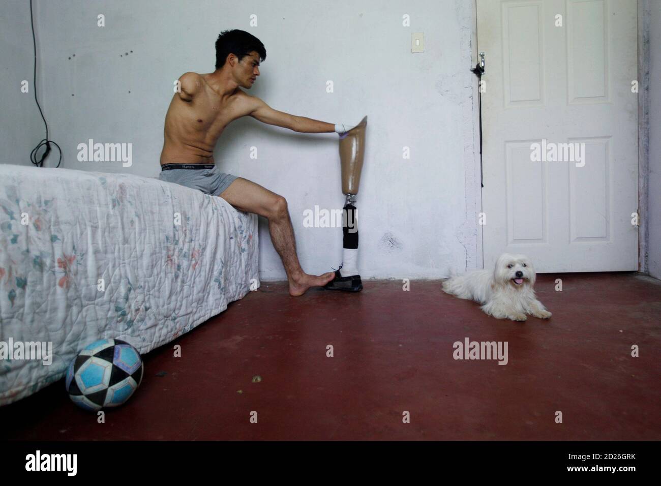 Train accident victim Jose Hernandez, 24, holds his prosthetic leg in El Progreso June 24, 2010. A migrant worker on his way to the ., Hernandez was ran over by a train Train accident victim Jose Hernandez, 24, holds his prosthetic leg in El Progreso June 24, 2010. A migrant worker on his way to the ., Hernandez was ran over by a train