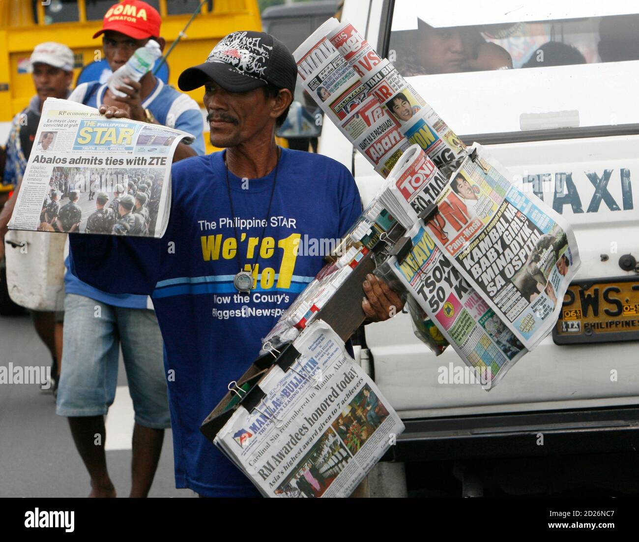 A Vendor Displays Newspapers And Cigarettes For Sale Along A Busy Street In Manila August 31 07 The Philippine Economy Has Expanded More This Year Than At Any Time In The Past A Vendor Displays Newspapers And Cigarettes For Sale Along A Busy Street In Manila August 31 07 The Philippine Economy Has Expanded More This Year Than At Any Time In The Past