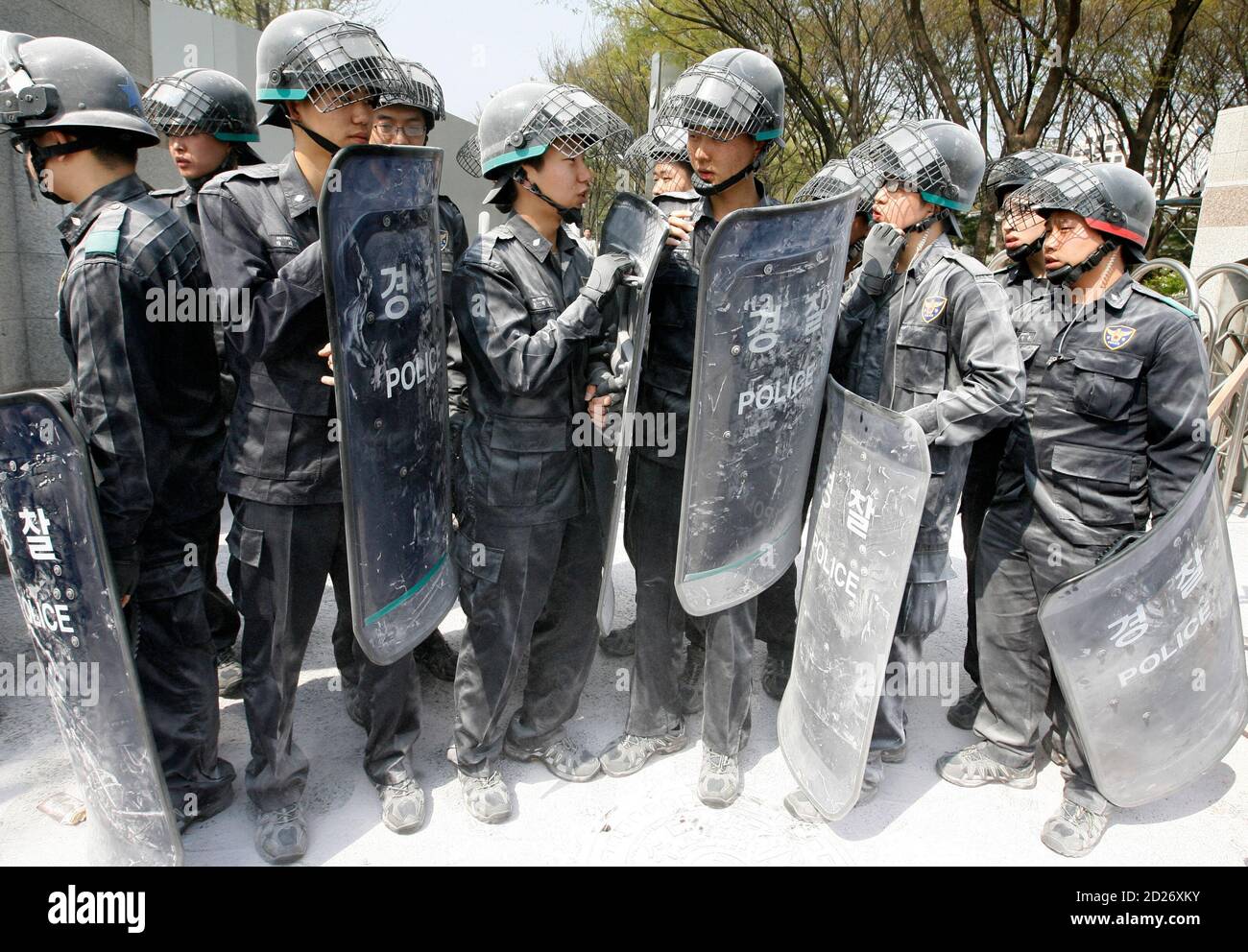 Policemen stand after they used fire extinguishers as anti-North 