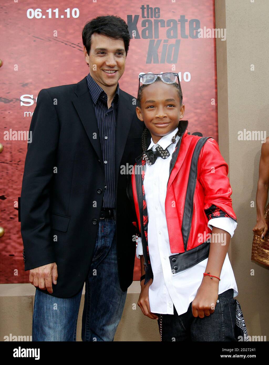 Cast member Jaden Smith (R) poses with actor Ralph Macchio, who starred in  the original 1984 movie, at the premiere of "The Karate Kid" at the Mann  Village theatre in Los Angeles
