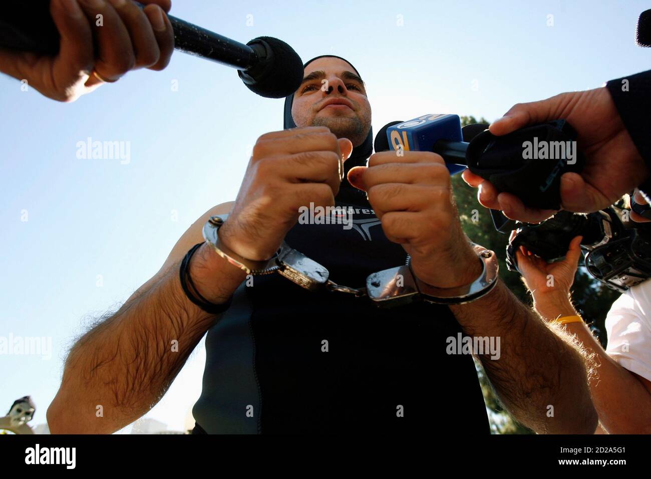 Hungarian escape artist David Merlini answers questions from reporters  after failing to break the world record for the longest time under water  without air at the Magic Castle in Hollywood, California October