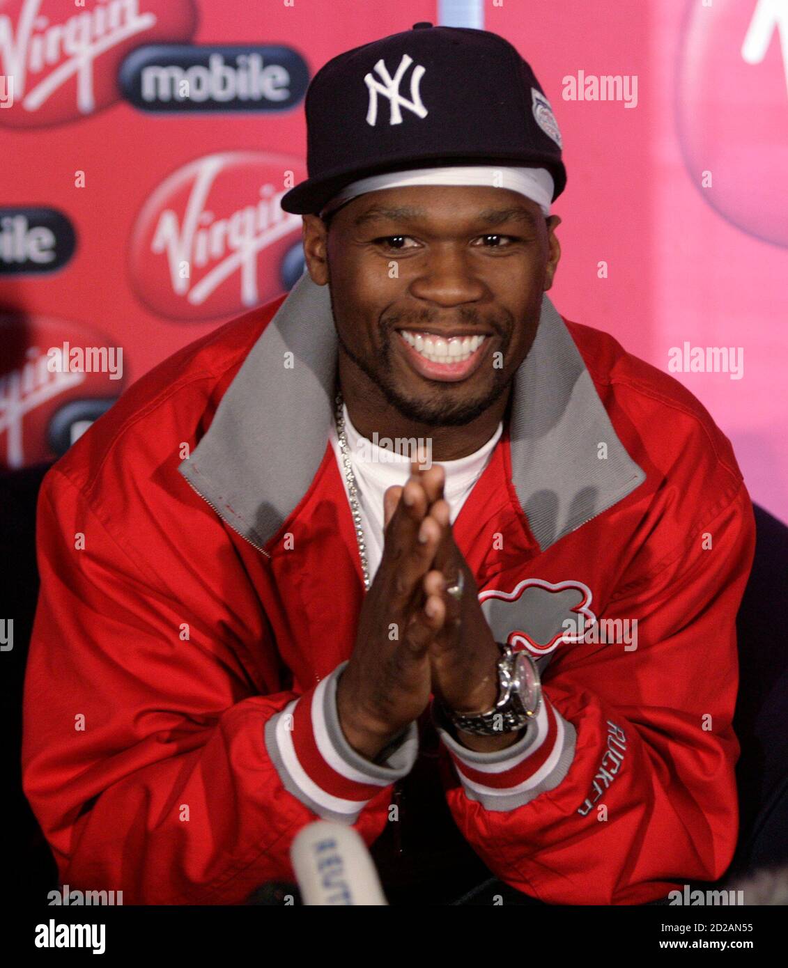 Rapper 50 Cent from the U.S. reacts during a media briefing at Lanseria  airport outside Johannesburg April 30, 2008. 50 cent together with his G- Unit crew will perform twice in South Africa,