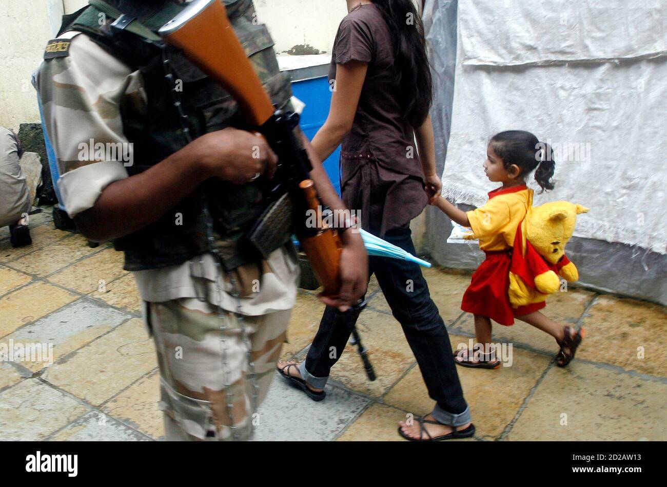 Paramilitary troops patrol a residential area around Arthur Road Jail,  where Mohammad Ajmal Kasab, the lone surviving gunman of the Mumbai attacks  is being held, in Mumbai July 20, 2009. Kasab made