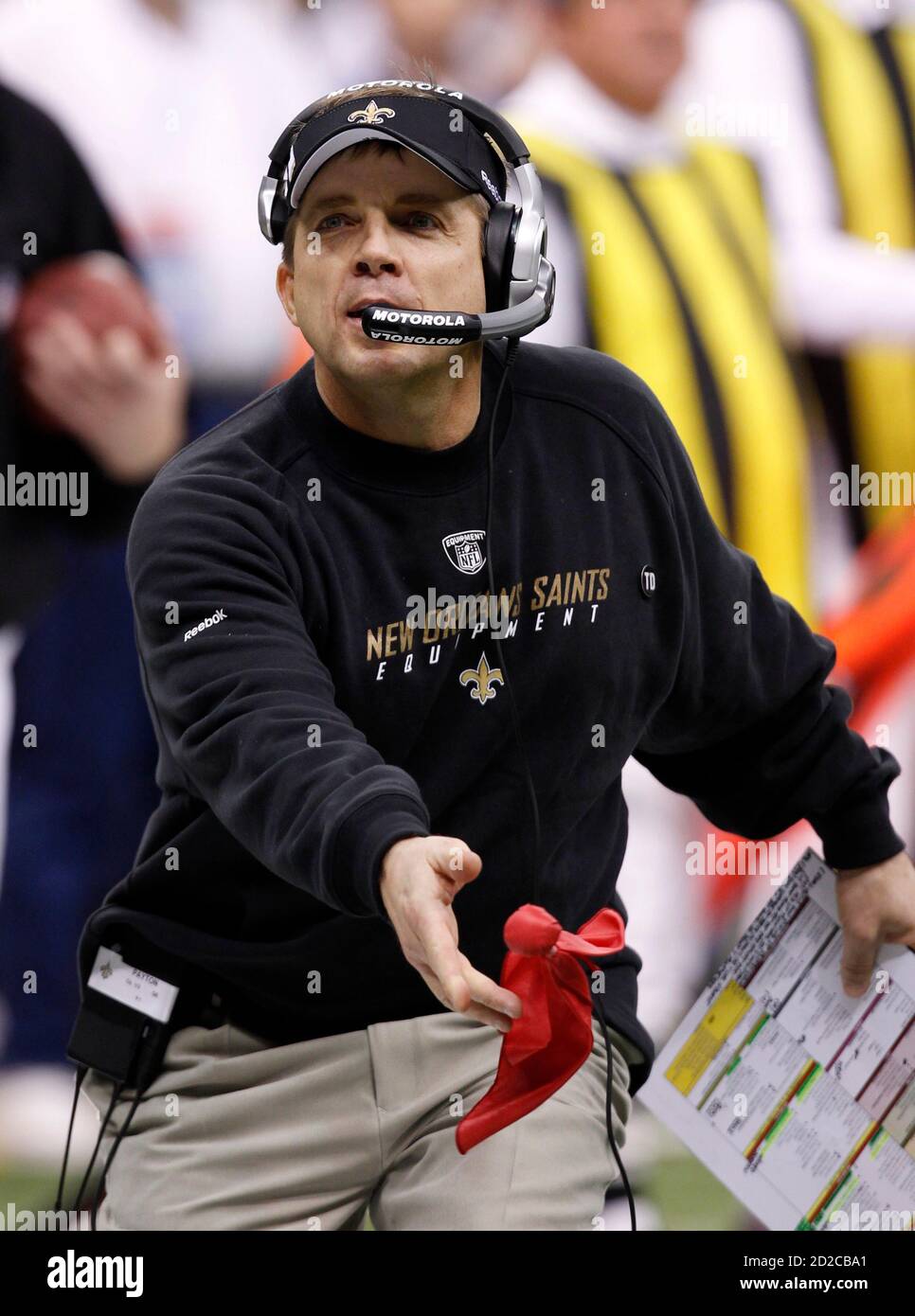 New Orleans Saints head coach Sean Payton tosses a challenge flag after  referees ruled that runningback Reggie Bush had not stayed in bounds while  diving for a touchdown against the Minnesota Vikings