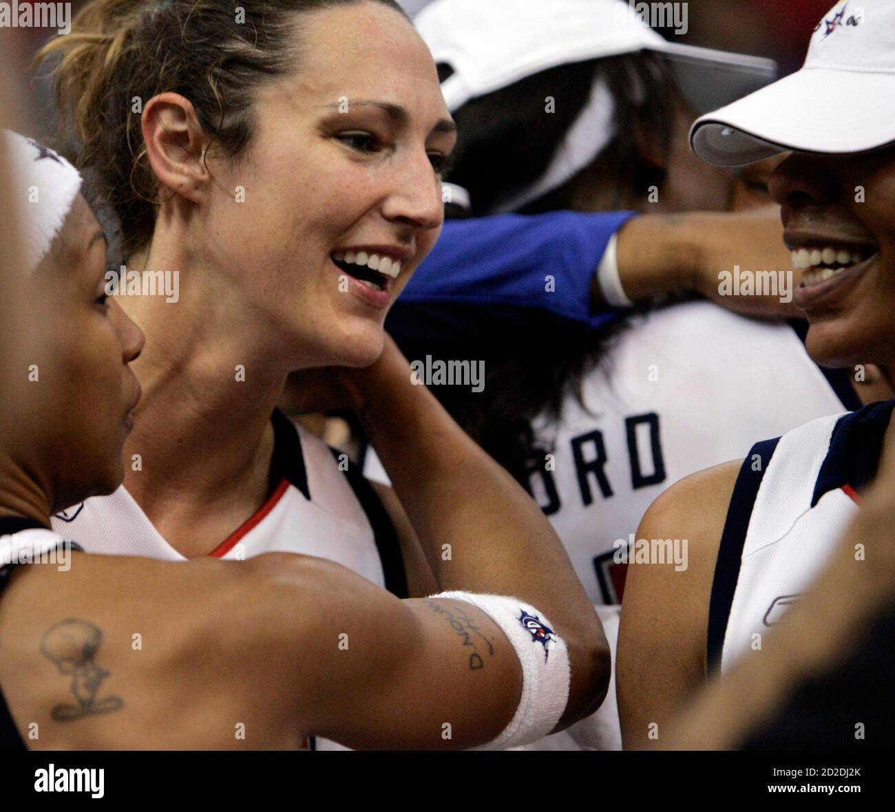 Detroit Shock's Deanna Nolan (L) and Ruth Riley (C) celebrate after Game 5  of their WNBA Finals against the Sacramento Monarchs at Joe Louis Arena in  Detroit, Michigan September 9, 2006. The