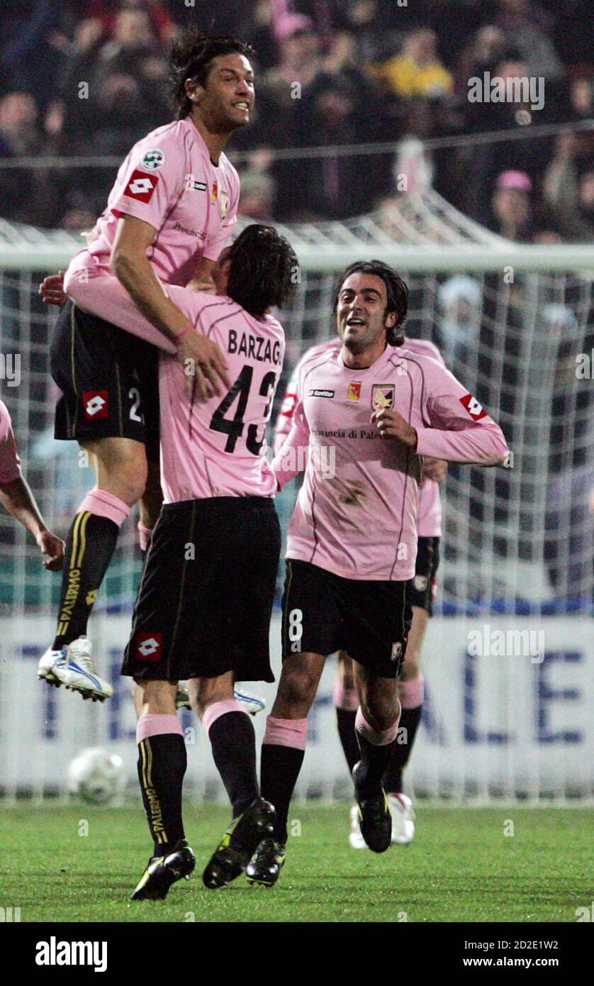 palermos-christian-terlizzi-l-celebrates-with-his-team-mate-andrea-barzagli-c-and-simone-barone-after-scoring-against-juventus-during-their-italian-serie-a-soccer-match-in-palermo-january-7-2006-reuters-antonio-parrinello-2d2e1w2.jpg