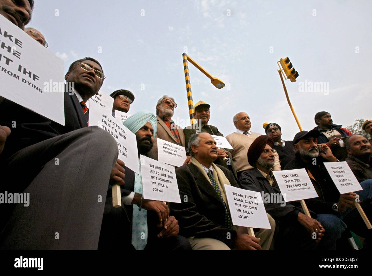 Former Indian hockey greats hold placards during a protest in New Delhi  December 20, 2006. Former Indian hockey greats have demanded the removal of  top federation officials after presenting a stinging protest