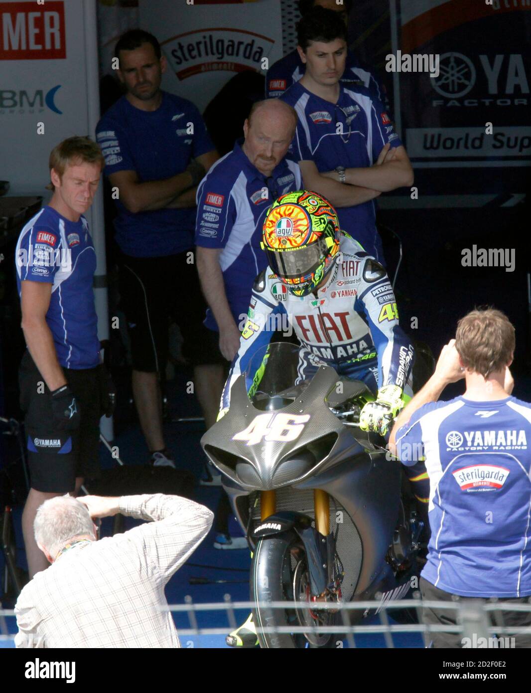 Yamaha MotoGP rider Valentino Rossi takes his bike onto the track at Brno  Masaryk circuit on July 12, 2010, as he assess his condition in the hope of  a quick return to