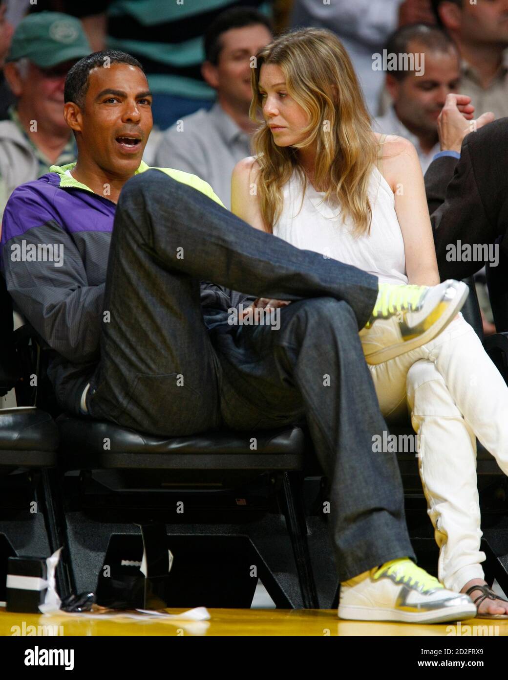 Actress Ellen Pompeo (R) and husband Chris Ivery attend Game 5 between the  Los Angeles Lakers and the Denver Nuggets of the NBA Western Conference  final basketball playoff game in Los Angeles