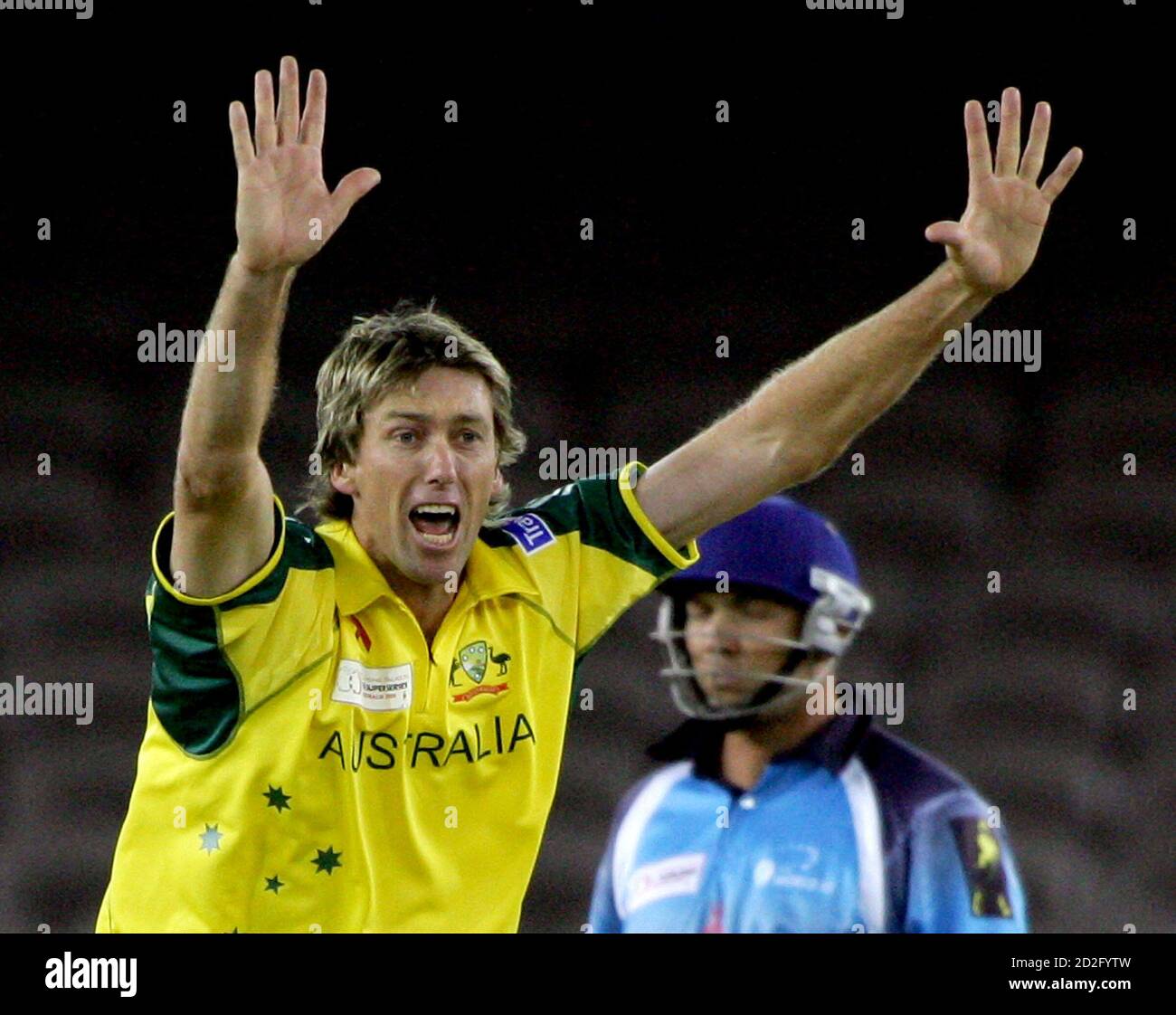 World XI team player Jacques Kallis (R) is dismissed LBW by Australia's Glenn  McGrath for eight runs during the first one-day game in the Super Series at  Melbourne's Telstra Dome October 5,
