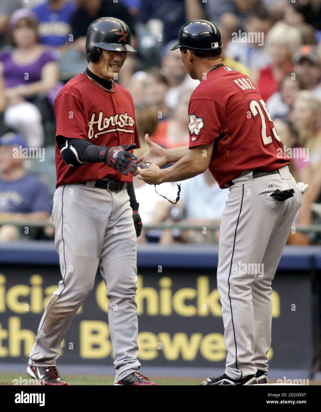 Houston Astros Batter Kazuo Matsui L Of Japan Is Congratulated By His First Base Coach Jose Cruz After His 2 000th Career Hit An Infield Single Off Milwaukee Brewers Starting Pitcher Mike Burns