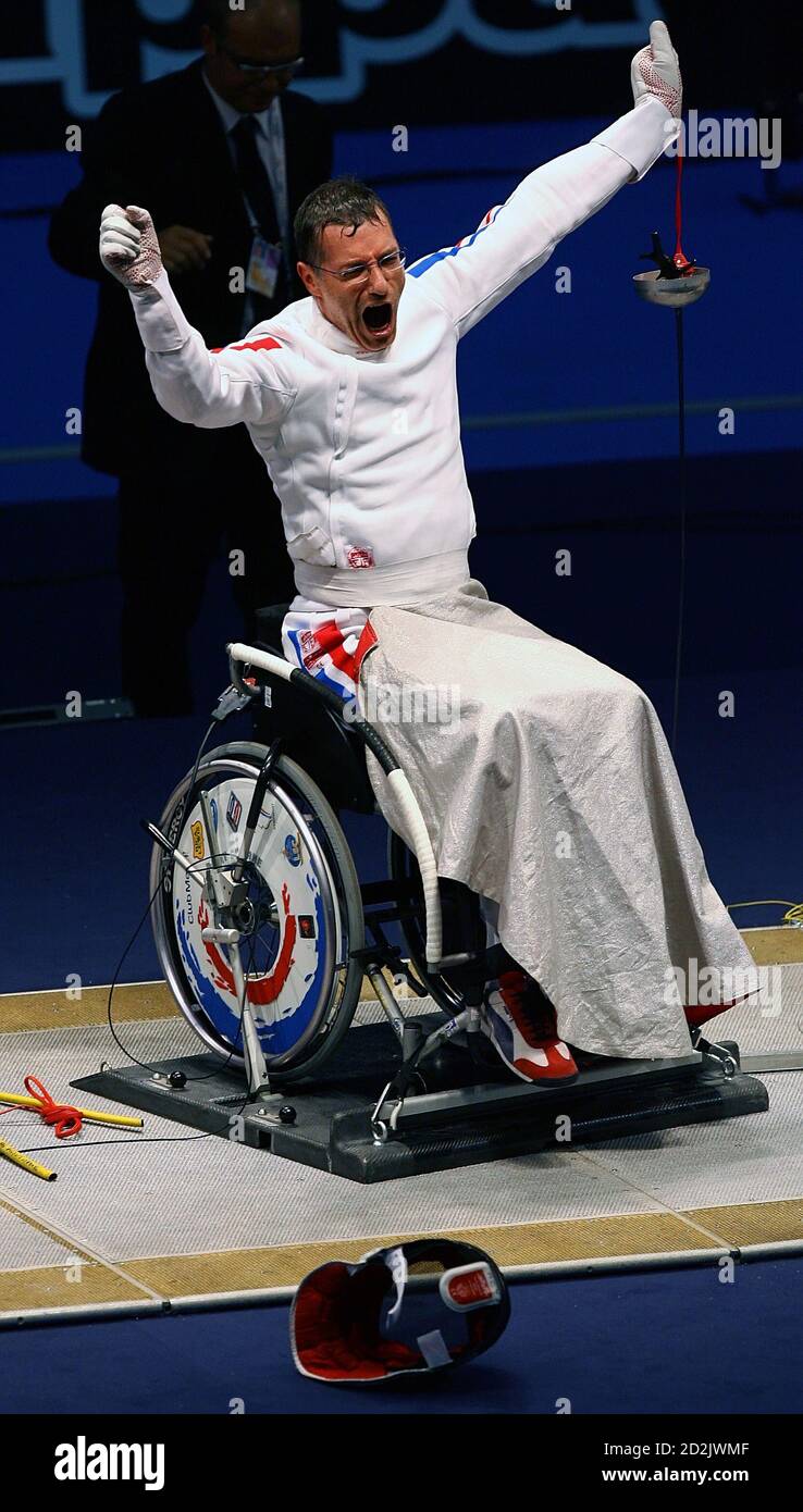 France's Robert Citerne reacts after beating China's Zhang Chong in their men's fencing